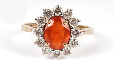 Lot 1207 - A fire opal and diamond cluster ring