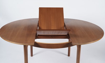 Lot 65 - McIntosh of Kirkaldy: A retro teak extending dining table and chairs