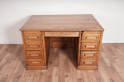 Lot 74 - A mid 20th Century oak pedestal desk