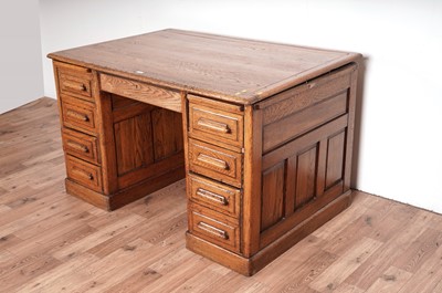 Lot 74 - A mid 20th Century oak pedestal desk