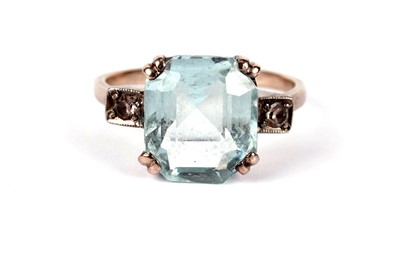 Lot 429 - An aquamarine and white sapphire dress ring