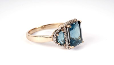 Lot 433 - A topaz and diamond ring; and a cluster ring