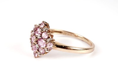 Lot 438 - A pink sapphire and diamond cluster ring