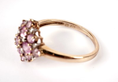 Lot 438 - A pink sapphire and diamond cluster ring