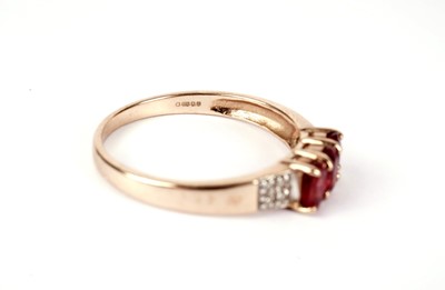 Lot 437 - Two red stone  dress rings
