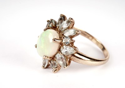 Lot 439 - An opal and blue stone cluster ring