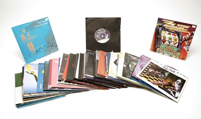 Lot 530 - A collection of mixed rock 7" singles