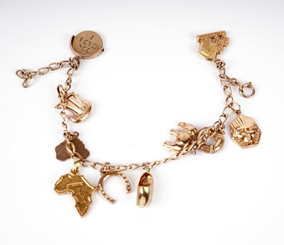 Lot 451 - A yellow gold charm bracelet