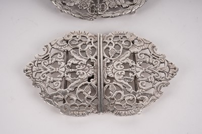 Lot 456 - An Edwardian silver belt buckle; and two others