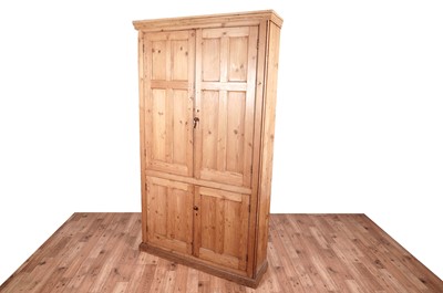 Lot 3 - A large 20th Century stripped pine cupboard
