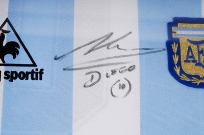 Lot 745 - An Argentina World Cup replica football shirt signed by Maradona