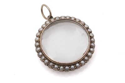 Lot 410 - A Victorian seed pearl and gold picture pendant