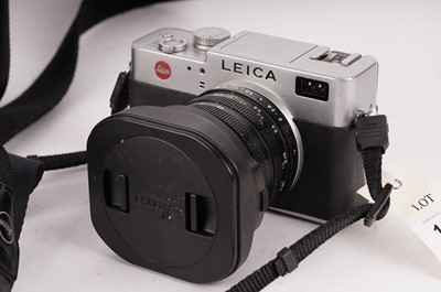 Lot 147 - A Leica camera and lens with a case