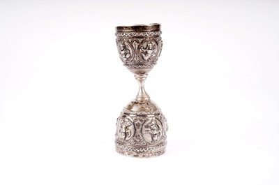 Lot 505 - An early 20th Century Indian white metal measure cup