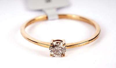 Lot 514 - A single-stone champagne diamond ring
