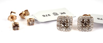 Lot 521 - Two pairs of champagne diamond earrings