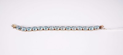 Lot 529 - A blue topaz and 9ct yellow gold bracelet
