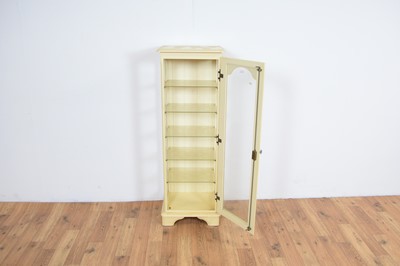 Lot 44 - A contemporary glazed display cabinet of upright form
