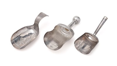 Lot 294 - Three caddy spoons in the form of scoops