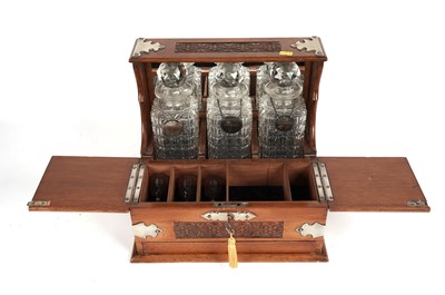 Lot 103 - A 20th Century oak three bottle tantalus