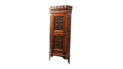 Lot 29 - A Victorian carved oak corner cabinet