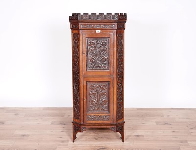 Lot 29 - A Victorian carved oak corner cabinet
