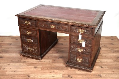 Lot 33 - A Victorian carved oak desk