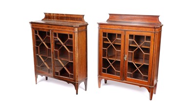 Lot 1003 - Two near-matching Edwardian satinwood and mahogany glazed bookcases