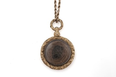 Lot 448 - A Victorian gold locket on chain