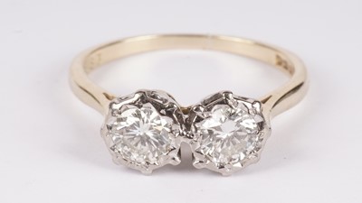 Lot 1104 - A two-stone diamond ring