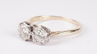 Lot 1104 - A two-stone diamond ring