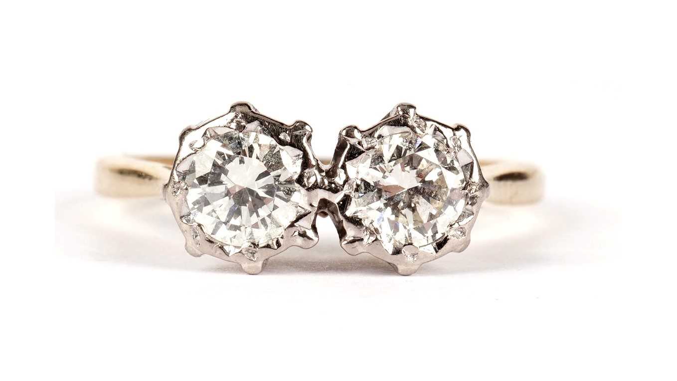 Lot 1104 - A two-stone diamond ring