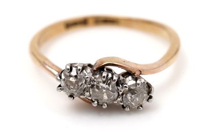 Lot 439 - A three stone diamond ring