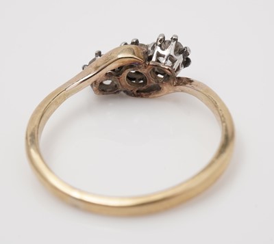 Lot 439 - A three stone diamond ring