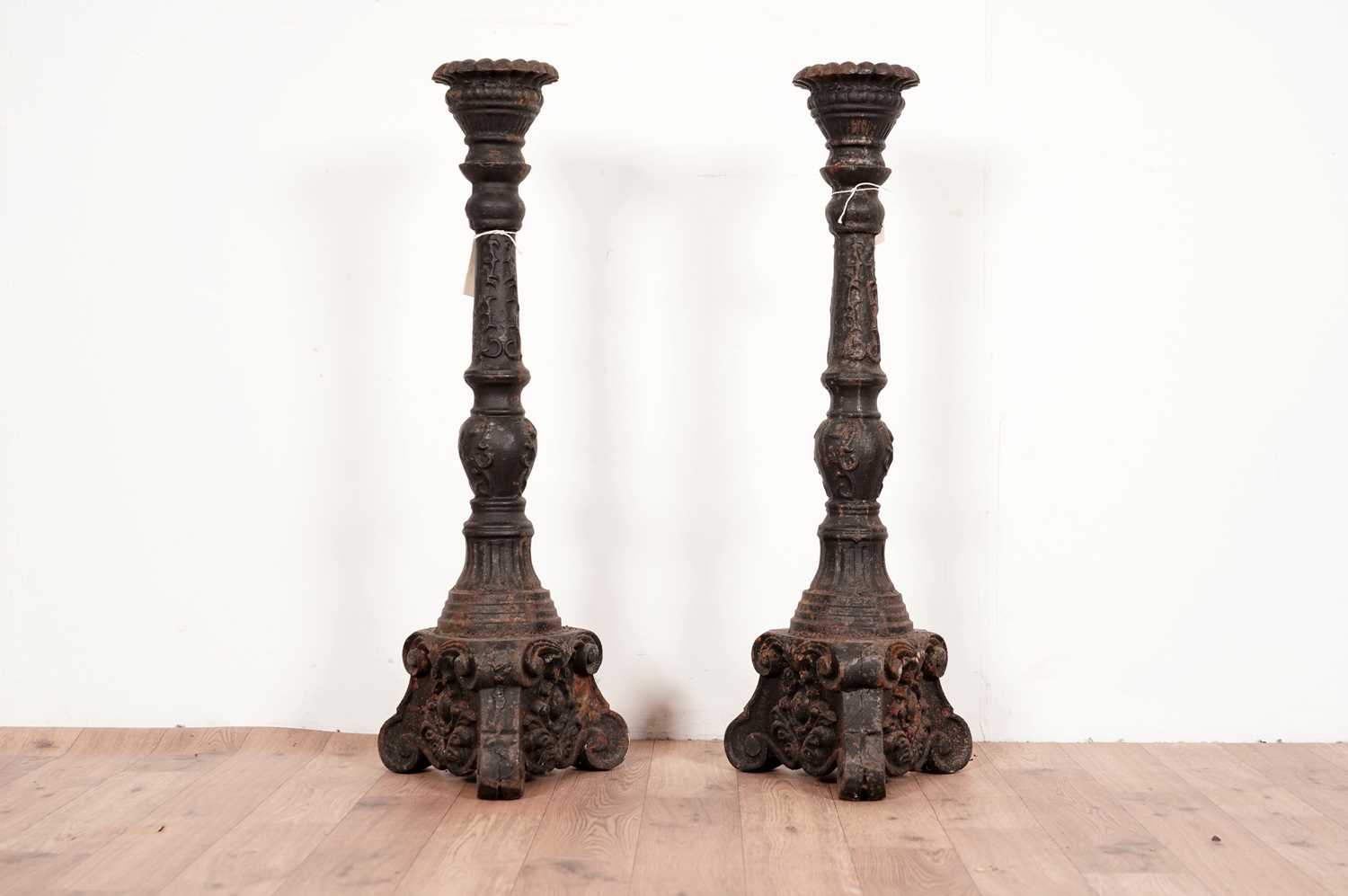 Lot 27 - A pair of cast iron candlesticks