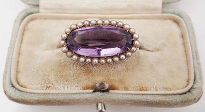 Lot 450 - An Edwardian amethyst and seed pearl brooch