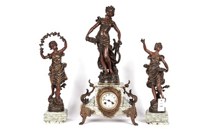 Lot 128 - A figural mantle clock, and bronzed figurines