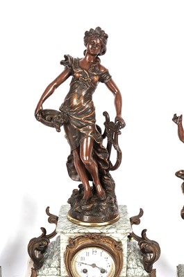 Lot 128 - A figural mantle clock, and bronzed figurines