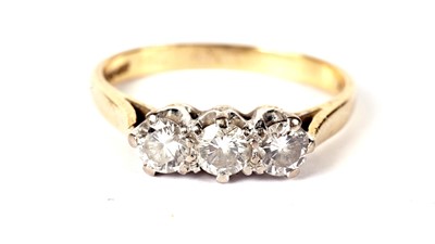 Lot 1216 - A three stone diamond ring