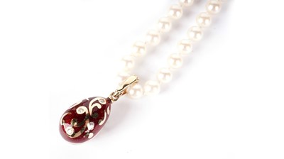 Lot 1217 - Faberge: an egg-pattern pendant on cultured pearl necklace