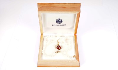 Lot 1217 - Faberge: an egg-pattern pendant on cultured pearl necklace