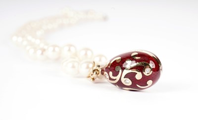 Lot 1217 - Faberge: an egg-pattern pendant on cultured pearl necklace