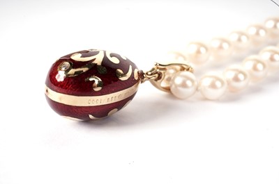 Lot 1217 - Faberge: an egg-pattern pendant on cultured pearl necklace