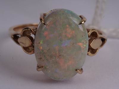 Lot 435 - An opal cabochon dress ring