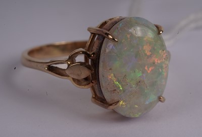 Lot 435 - An opal cabochon dress ring