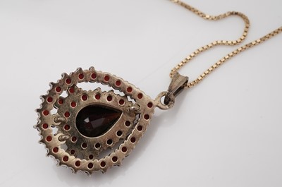 Lot 437 - A garnet and yellow metal cluster pendant on chain