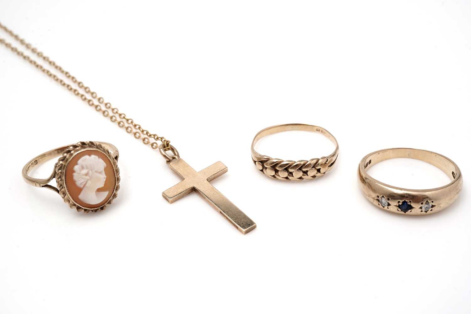 Lot 440 - Three 9ct yellow gold rings, and crucifix pendant