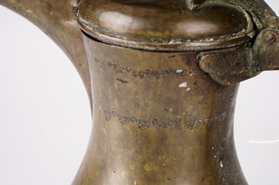 Lot 928 - A bronze Islamic dallah coffee pot, given as a gift by the Crown Prince of Jordan 1992