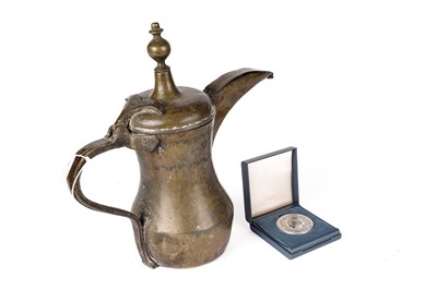 Lot 928 - A bronze Islamic dallah coffee pot, given as a gift by the Crown Prince of Jordan 1992
