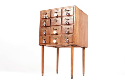 Lot 69 - A vintage pine index filing cabinet